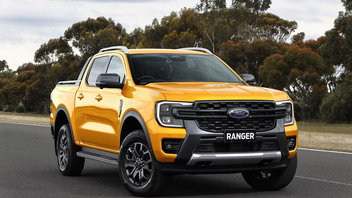 2019 Ford Ranger cruising down a road, emphasizing its power and durability, ideal for showcasing the integration of a subwoofer box for enhanced audio experience.
