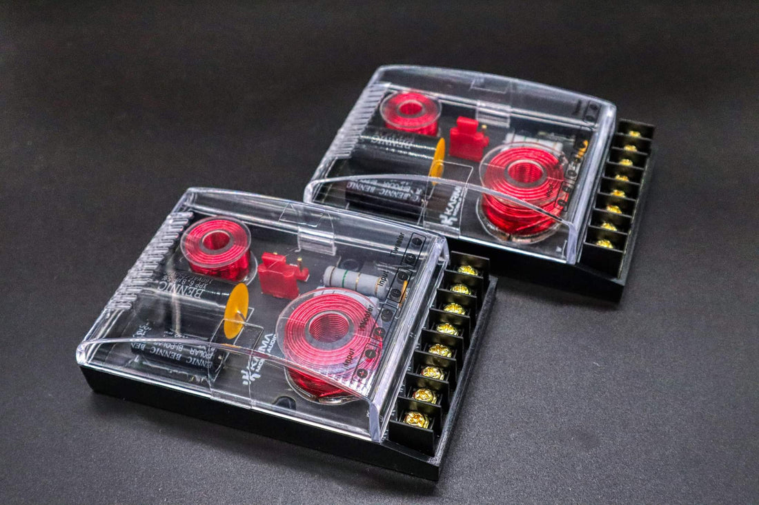 Two transparent electronic components with red and yellow elements on a dark background