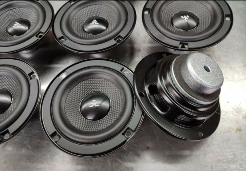 Set of speakers on a metallic surface