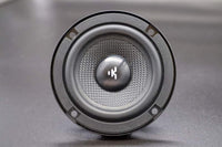 Speaker driver with brand logo on a gray background