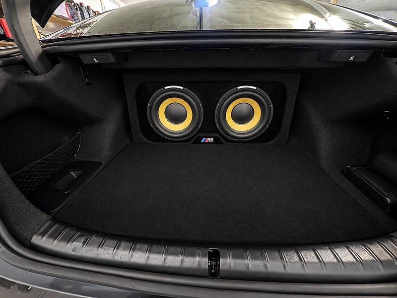 Customer install: Focal SUB 25 KXE Dual Box: Sealed 10" Wedge Enclosure in a BMW 5 Series, running Focal 25 KXE