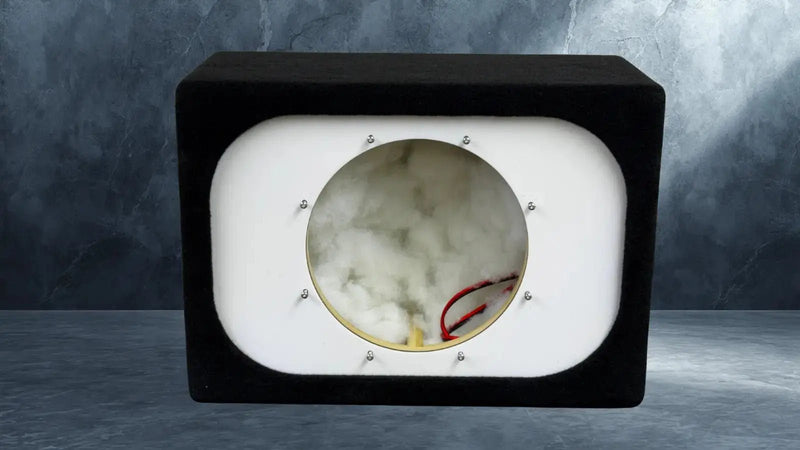 Marble-like material sample in a black and white display case on a gray background