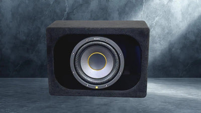 Car subwoofer enclosure with visible brand logo on a gray background