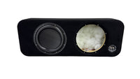 Black audio subwoofer with a decorative element on a white background