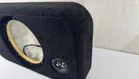 Black car speaker enclosure with visible driver and subwoofer on a white surface.