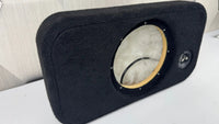 Car audio subwoofer enclosure with a visible brand logo on a white surface.