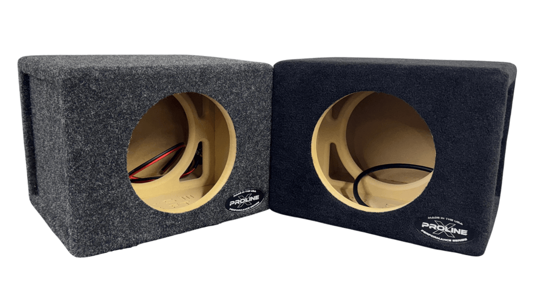 Two car audio (1 black & 1 grey) subwoofer enclosures with visible brand logo on a white background