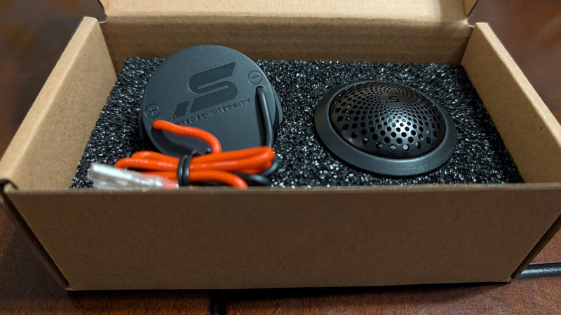 Stereo Integrity M22 tweeter pair in the box, one turned to show the rear leads