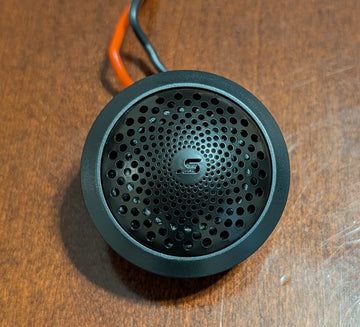 Stereo Integrity M22 tweeter, front view of the laser-etched stainless steel grille