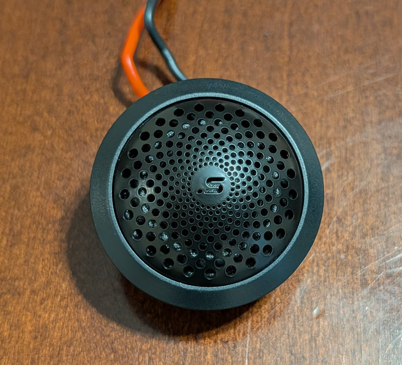 Stereo Integrity M22 tweeter, front view of the laser-etched stainless steel grille